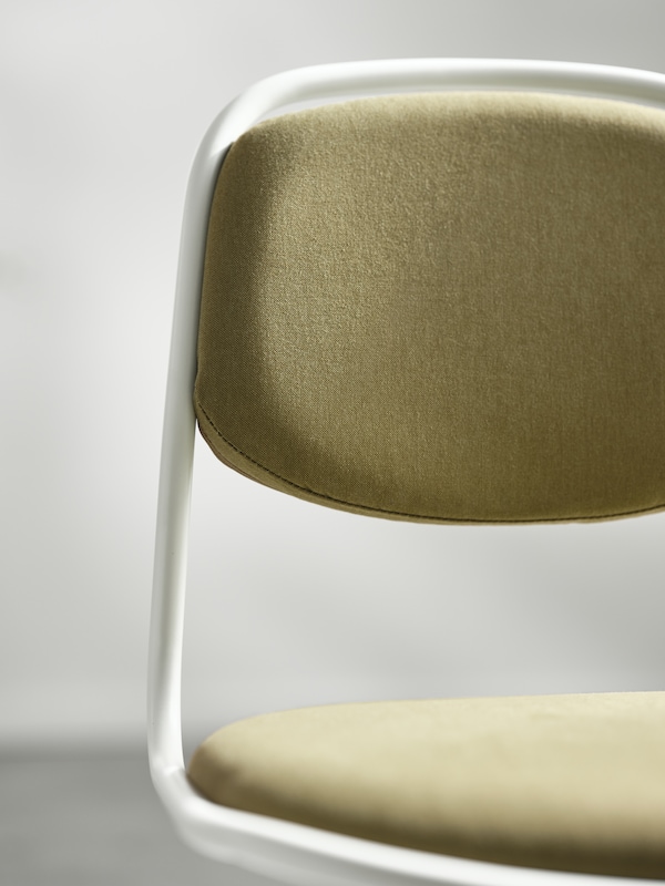 The top part of a white and yellow-green ÖRFJÄLL swivel chair, showing the upholstery on the backrest and the seat.