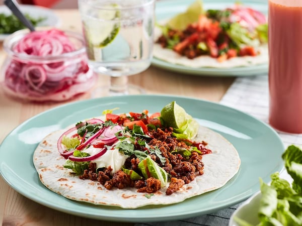 Plant-based tacos with pickled onions, pico de gallo and guacamole