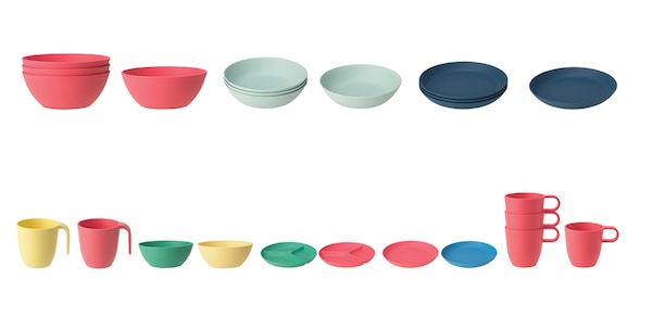 Several colorful bowls, plates, and cups lined up in a row against a white background.