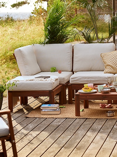 Sofa outdoors with cofee table on deck