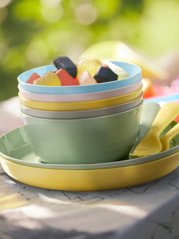 Stackable kids plateware in neutral pastels. 